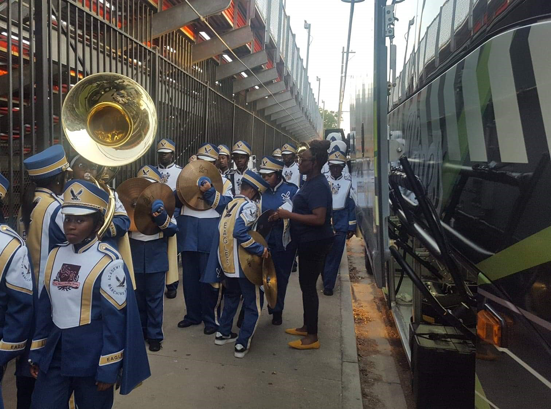 Band outside a Georgia Coach Lines bus